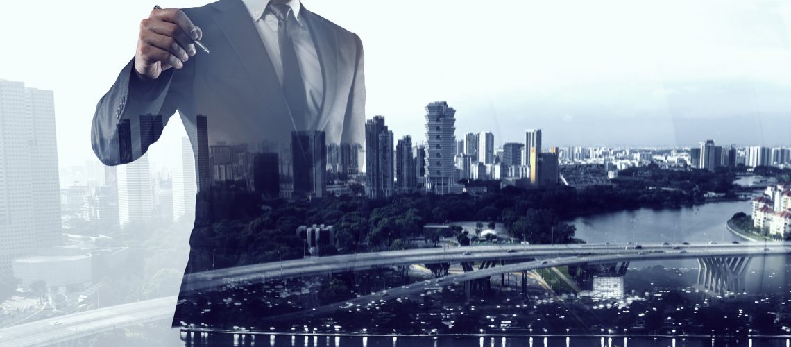 Double exposure of businessman and modern cityscape. Mixed media